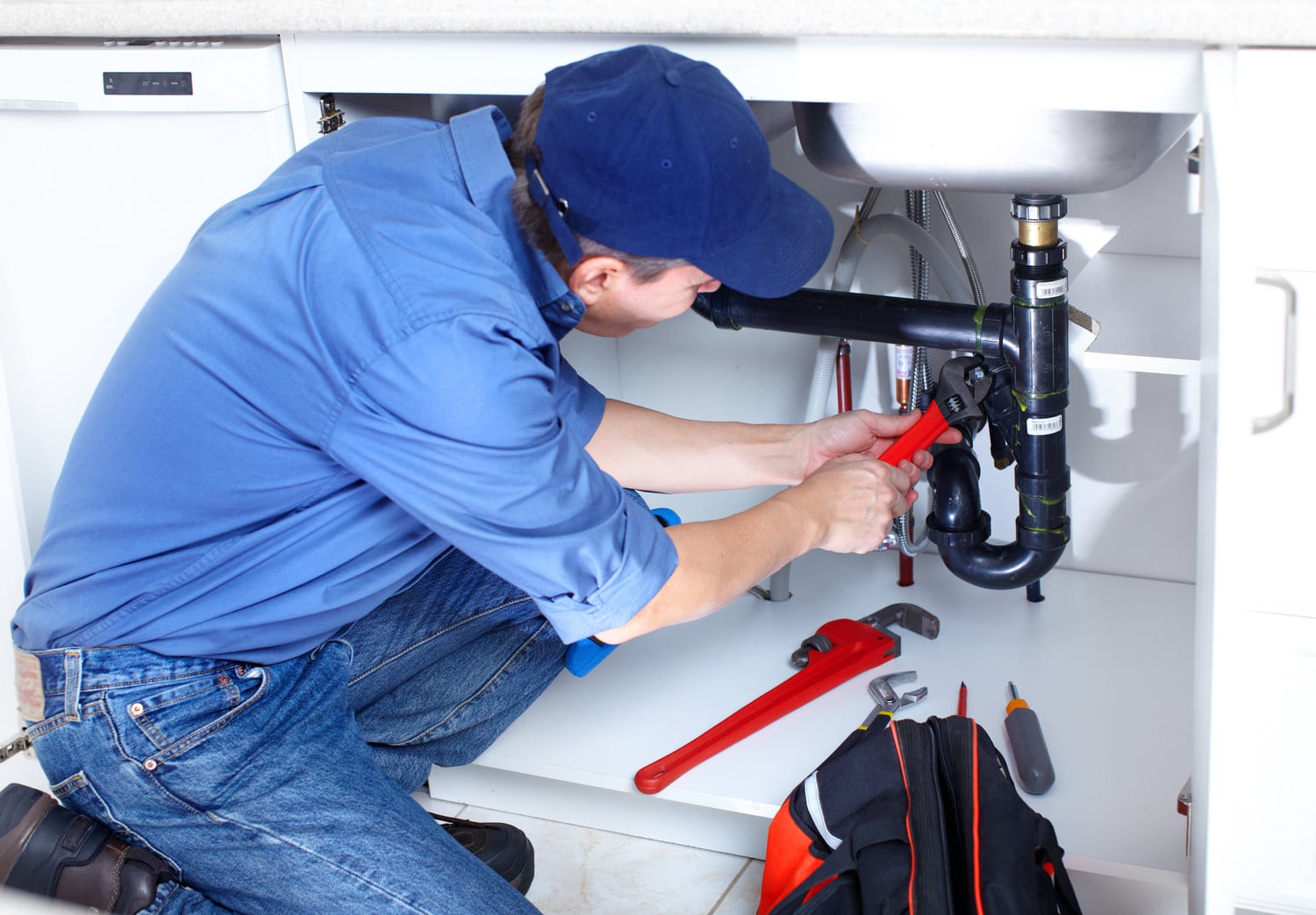 Plumber Fixing a Sink